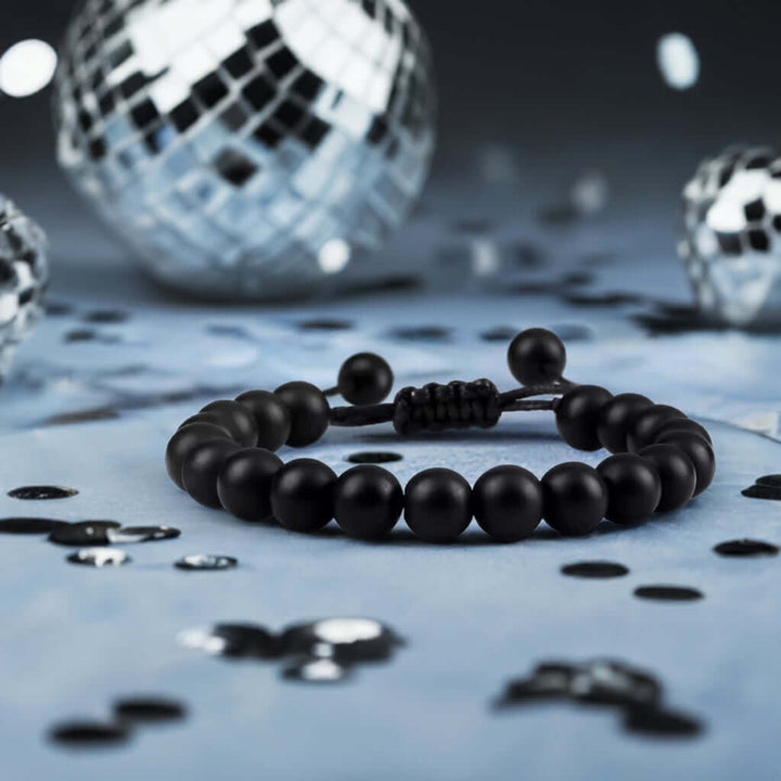 Black men's adjustable bracelet with natural onyx beads, perfect accessory for stylish jewelry layering.