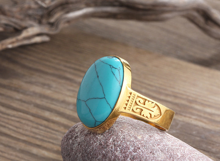 patterned yellow gold ring with stone